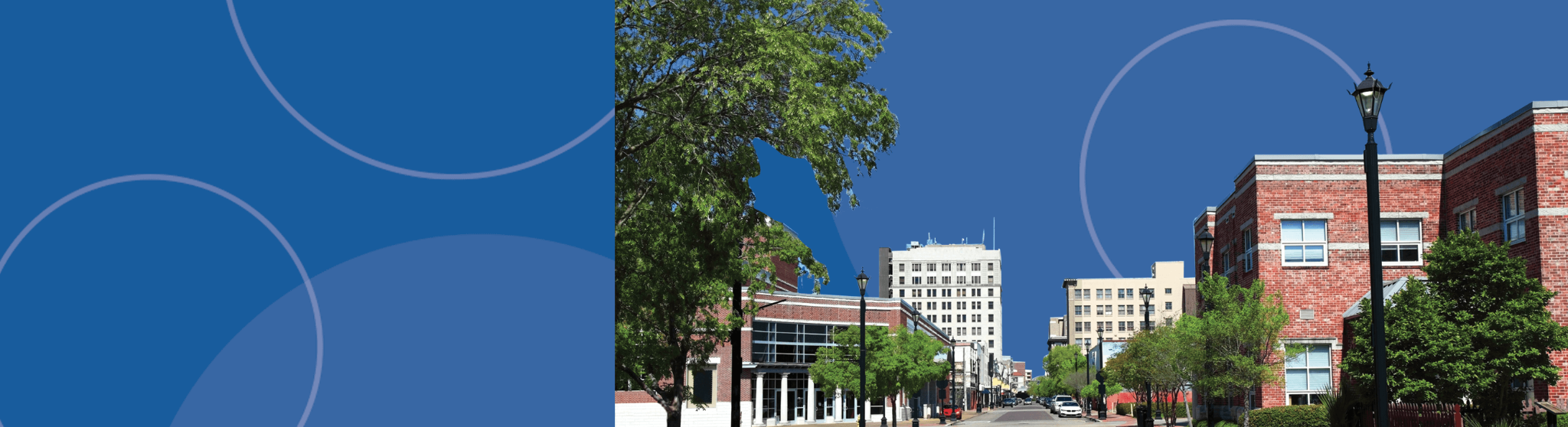 Downtown Alexandria, Louisiana, featuring red brick buildings and greenery, representing workers' compensation services in the area.